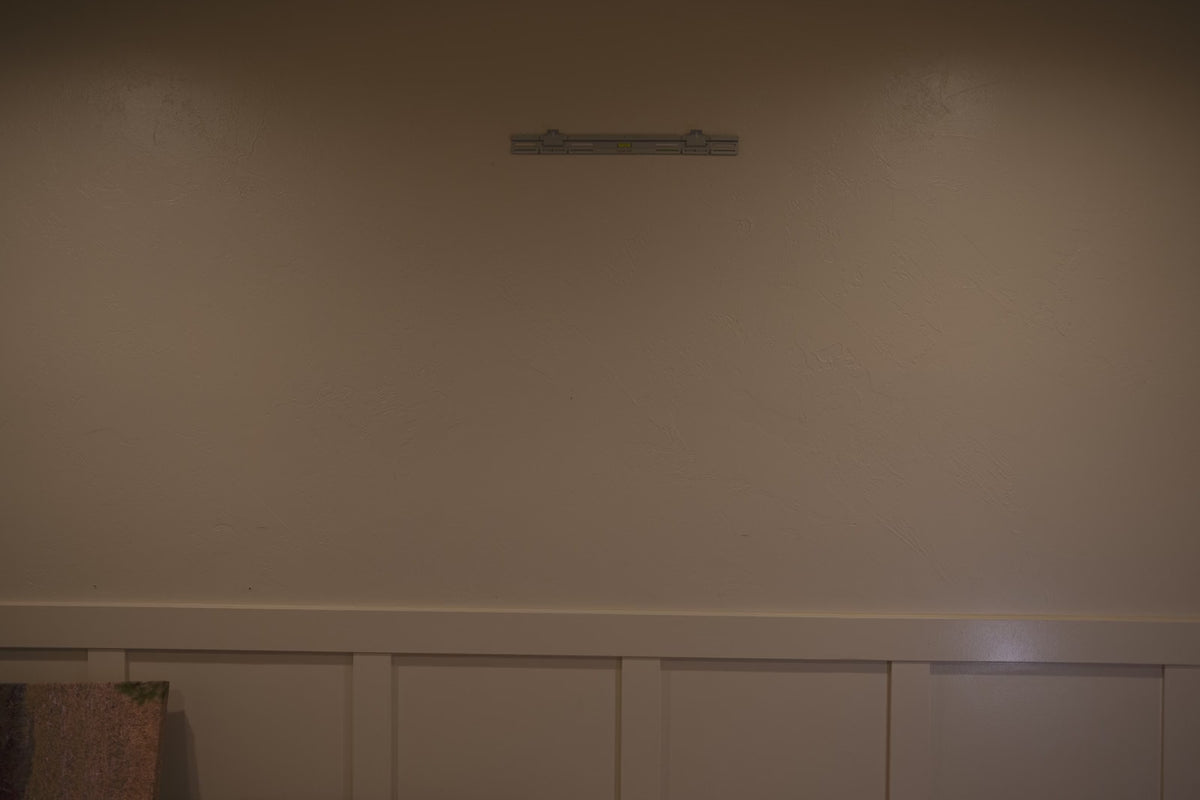 Video of framed art and canvas appearing on a SecurArt wall mount