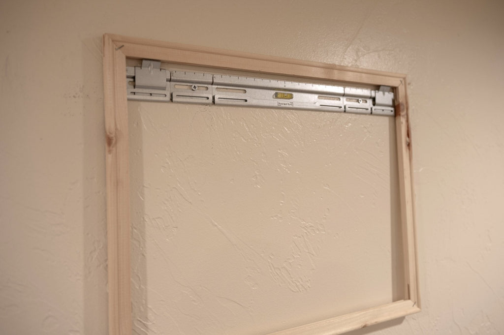 SecurArt mount installed inside a wooden stretcher frame