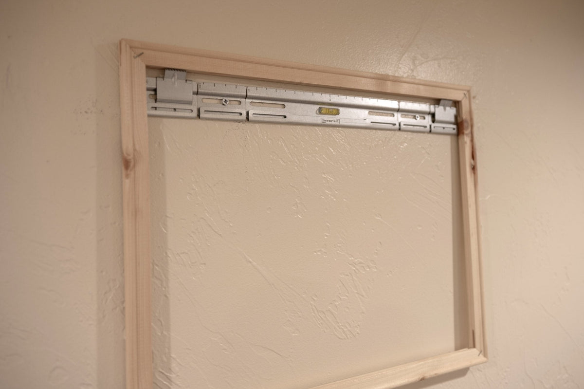 SecurArt mount installed inside a wooden stretcher frame
